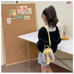 Detail view of yellow girl doll crossbody bag with pearls and sequins for children
