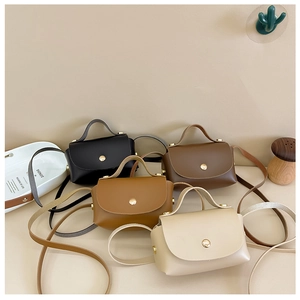 Close-up of mini PU leather crossbody bags in four colors with gold magnetic snaps