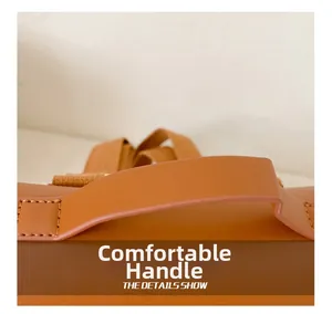 Close-up of comfortable reinforced handle on retro style PU leather kids backpack