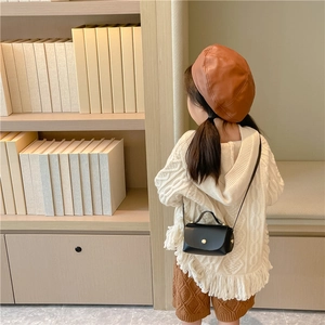 Fashionable black leather mini crossbody bag for girls styled with autumn accessories
