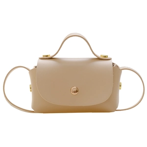 Minimalist beige mini crossbody bag for girls with gold rivets and top handle