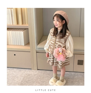 Detail view of khaki striped knit vest, white blouse and cute doll handbag for girls
