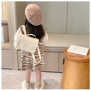 Detailed back view of a beige PU leather toddler backpack with cute bear embossing