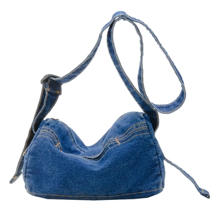 Minimalist denim crossbody bag for kids featuring vintage blue wash and orange stitching