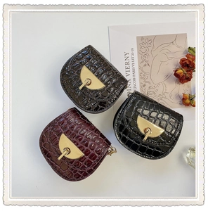 Three colors of mini faux crocodile leather crossbody bags with golden metal clasps