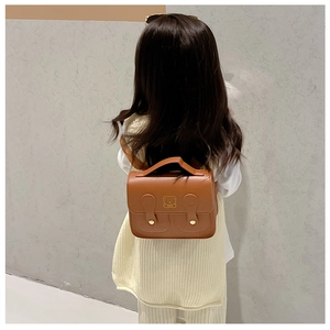 Brown PU leather mini backpack for kids featuring golden bear motif and double buckles