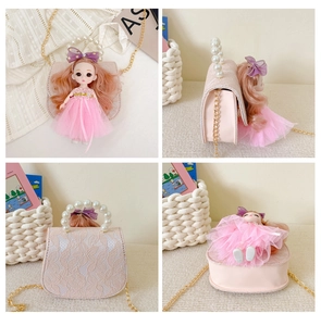 Detail of pink lace girls' bag with pearl handle, gold chain, and cute doll accessory