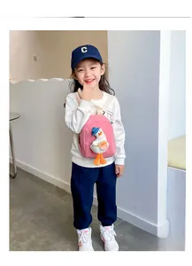 Pink kids canvas backpack featuring a 3D plush duck with blue hat and orange bag details