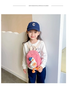 Toddler girl wearing pink canvas mini backpack with cute 3D plush duck decoration