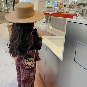 Girl's leopard print mini saddle bag and khaki wool hat with retro plaid outfit