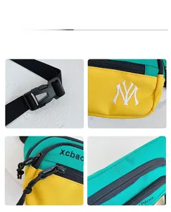 Detailansicht der grün-gelben Canvas-Brusttasche mit NY-Stickerei und Kunststoff-Schnalle
