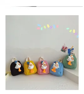 Detail display of five canvas kids backpacks with cute 3D plush duck in multiple colors