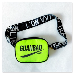 Macro detail of neon green crossbody bag with sporty branding and wide graphic strap