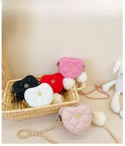 Detail showing heart-shaped quilted crossbody bags in five colors with clover gold buckles
