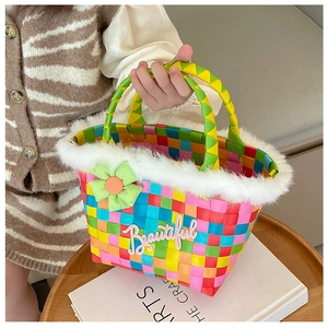 Close-up of woven floral kids handbag featuring white faux fur trim and Beautiful embroidery