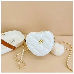 White heart-shaped quilted bag with gold clover buckle and soft faux fur pom-pom detail