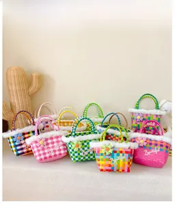 Detail of colorful checkered woven basket bags with plush fur trim and floral accents