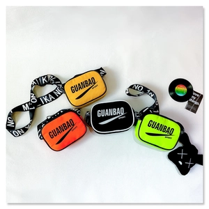 Detail of colorful mini crossbody bags with bold letter straps in orange, yellow, and green