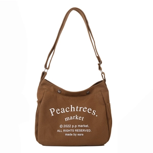 Deep brown canvas crossbody bag with white letter print and snap closure for kids
