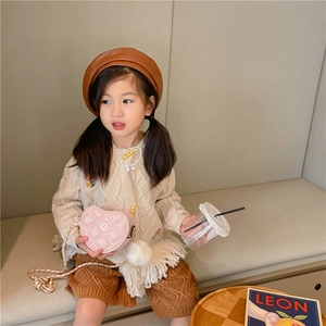 Pink heart quilted crossbody bag for girls featuring a chain strap and fur ball decor