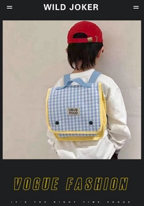 Rear view of a child wearing a blue and white checkered canvas backpack with yellow straps