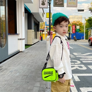 Neon green kids crossbody bag with black sport letters and wide adjustable shoulder strap