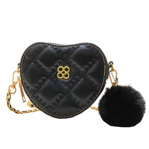 Kids heart-shaped black quilted crossbody bag with gold clover clasp and fluffy pompom