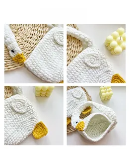 Macro view of tight hand-knitted stitches and texture on the white goose plush handbag