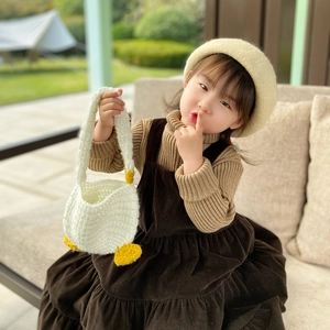 Handmade white knit duckling handbag for children with cute yellow feet and soft texture