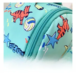 Detailed view of the smooth mint green zipper and cute dinosaur print on the canvas backpack