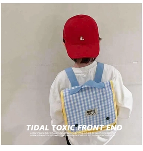 Kids checkered canvas backpack and red baseball cap set shown on child model back