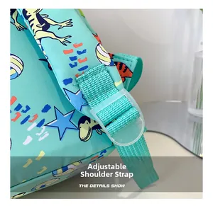 Detail of adjustable woven shoulder strap and plastic buckle on dinosaur kids backpack