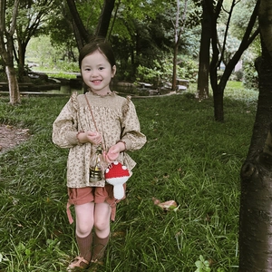 Handmade mushroom knit bag with girl's floral blouse and retro pastoral outfit
