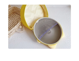 Vue intérieure du sac rond jaune montrant la poche en filet et les détails de fermeture