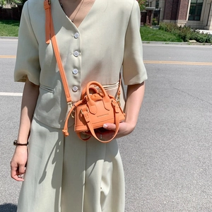 Mini orange shell bag for kids made of PU leather with crossbody strap for outdoor fashion