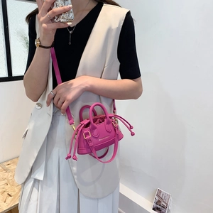 Mini shell-shaped drawstring handbag in rose red with adjustable crossbody strap