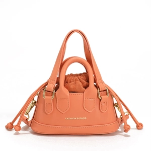 Mini orange shell-shaped kids handbag with drawstring pouch and gold fashion text