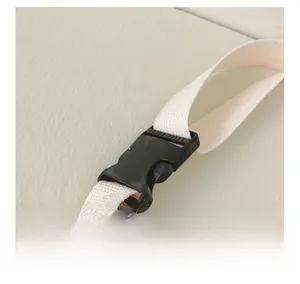 Close-up of durable black plastic buckle and white nylon strap for children chest bag