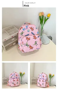 Detailed views of the pink canvas toddler backpack with cartoon dinosaur prints