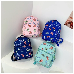 Detail view of multi-color canvas kids backpacks with cartoon dinosaur prints and stars