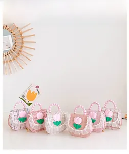 Detail of tweed girls bags featuring pearl handles and 3D tulip doll decorations