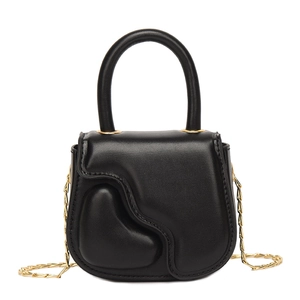 Mini black handbag for kids featuring embossed heart pattern and golden chain strap