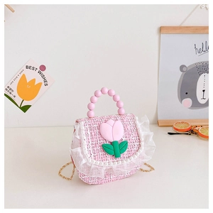 Detail of pink tweed flower bag with pearl lace edges and beaded handle for girls