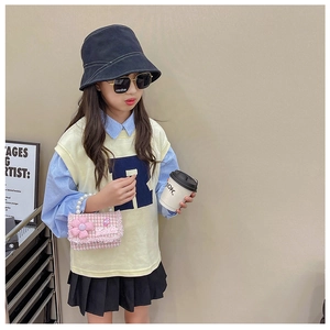 Girl's pink flower pearl handbag styled with a trendy autumn fashion outfit