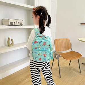 Cute cartoon dinosaur backpack for toddlers featuring mint green canvas and a lightweight design