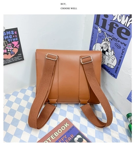Detail view of the brown PU school bag back structure with durable silver metal buckles