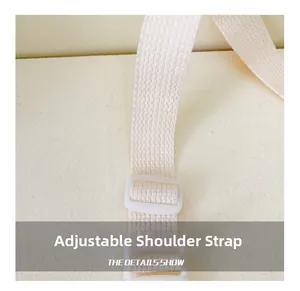 Close-up of adjustable woven shoulder strap with white buckle on a children crossbody bag