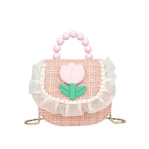 Pink tweed floral kids handbag with pearl bead handle and lace trim on white background