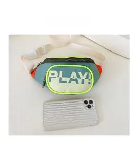 Detailed view of kids crossbody bag in blue and orange with white PLAY text and phone