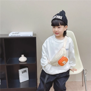 Kids color-block crossbody bag in cream canvas with orange pocket and letter R detail